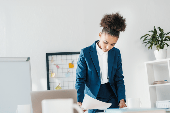 Woman checking papers on table