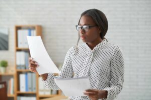 Woman checking papers