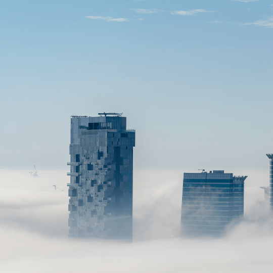 Two building above the clouds