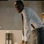 Man in the office looking at the camera