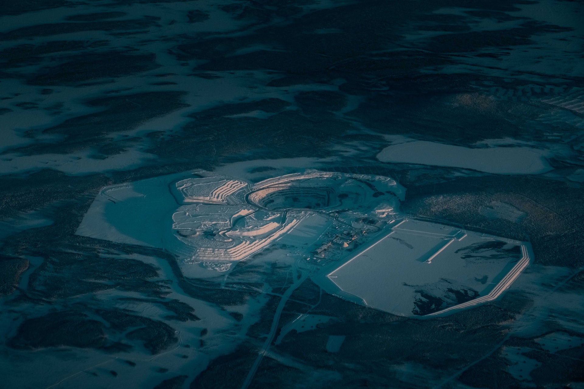 Open pit mine in snow