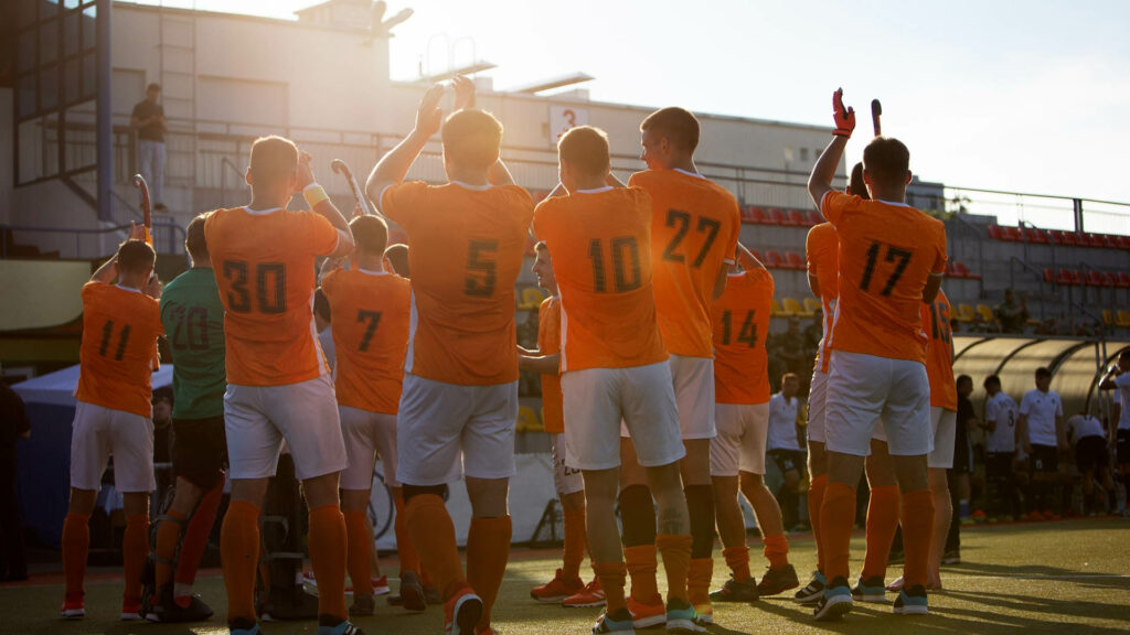 Team applauds the fans and management after a game