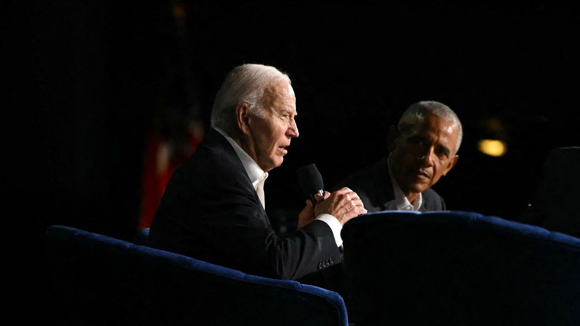 Democrats Push for Biden to Step Down | Brimco President joe biden speaking into a microphone with former president barack obama listening beside him during an event