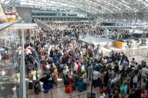 Crowded airport terminal with passengers affected by a global tech outage