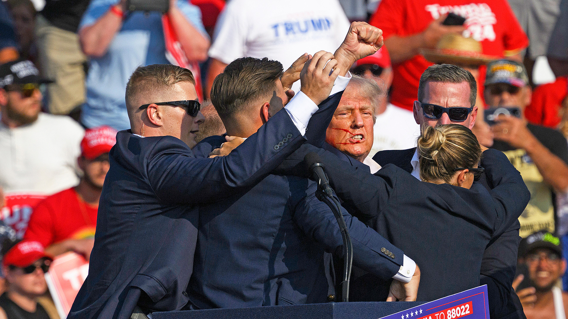 Butler pennsylvania   july 13 secret service agents surround republican presidential candidate former president donald trump onstage after he was injured at a rally on july 13 2024 in butler pennsylvania According to butler county district attorney richard goldinger the suspected gunman is dead after injuring former president trump killing one audience member and injuring at least one other Photo by jeff swensengetty images
