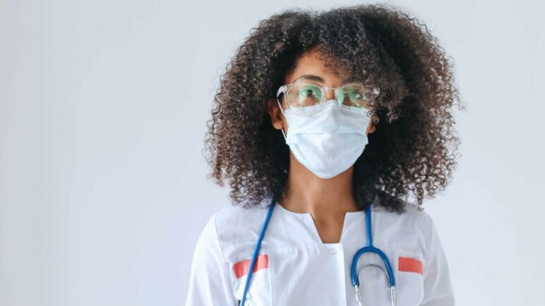 Female wearing mask and stethoscope