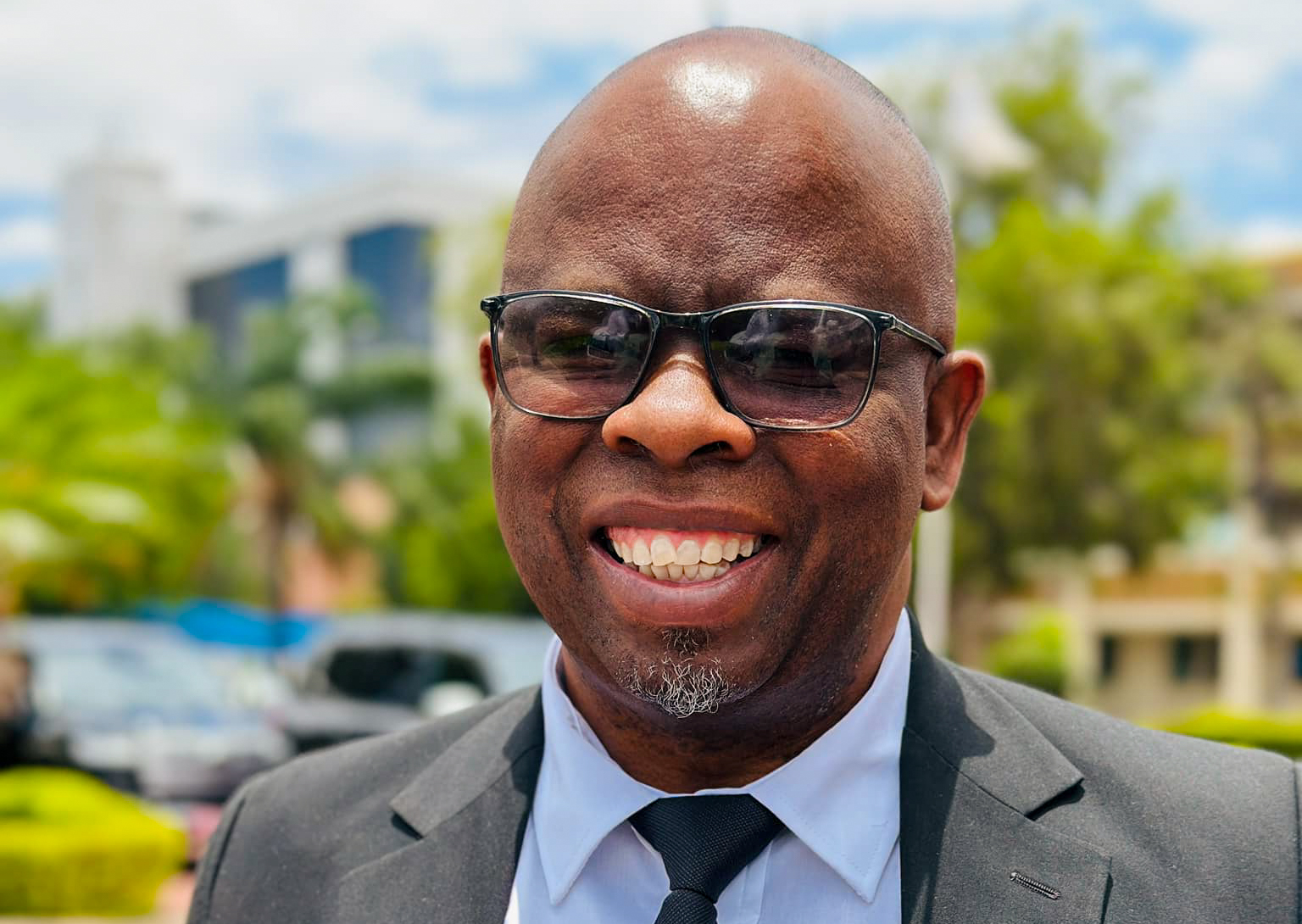 Ignatius Moswaane Appointed as Assistant Minister of Local Government and Traditional Affairs | Brimco Assistant minister of local government and traditional affairs ignatius moswaane smiling outdoors during the swearing in of new cabinet ministers in botswana