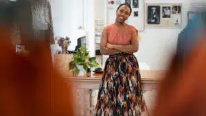 Female small business owner standing confidently in a fashion boutique in botswana