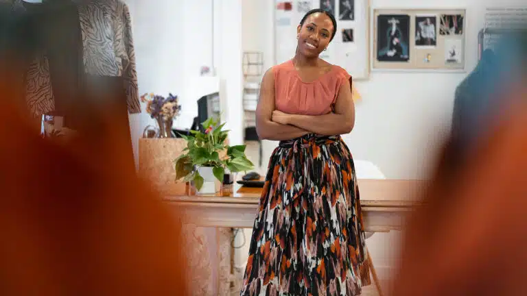 Female small business owner standing confidently in a fashion boutique in botswana