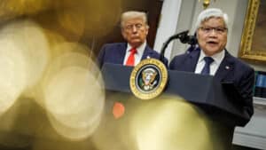Tsmc ceo c C Wei speaks at a podium in washington d C  announcing a 0 billion u S Investment while president donald trump stands behind him