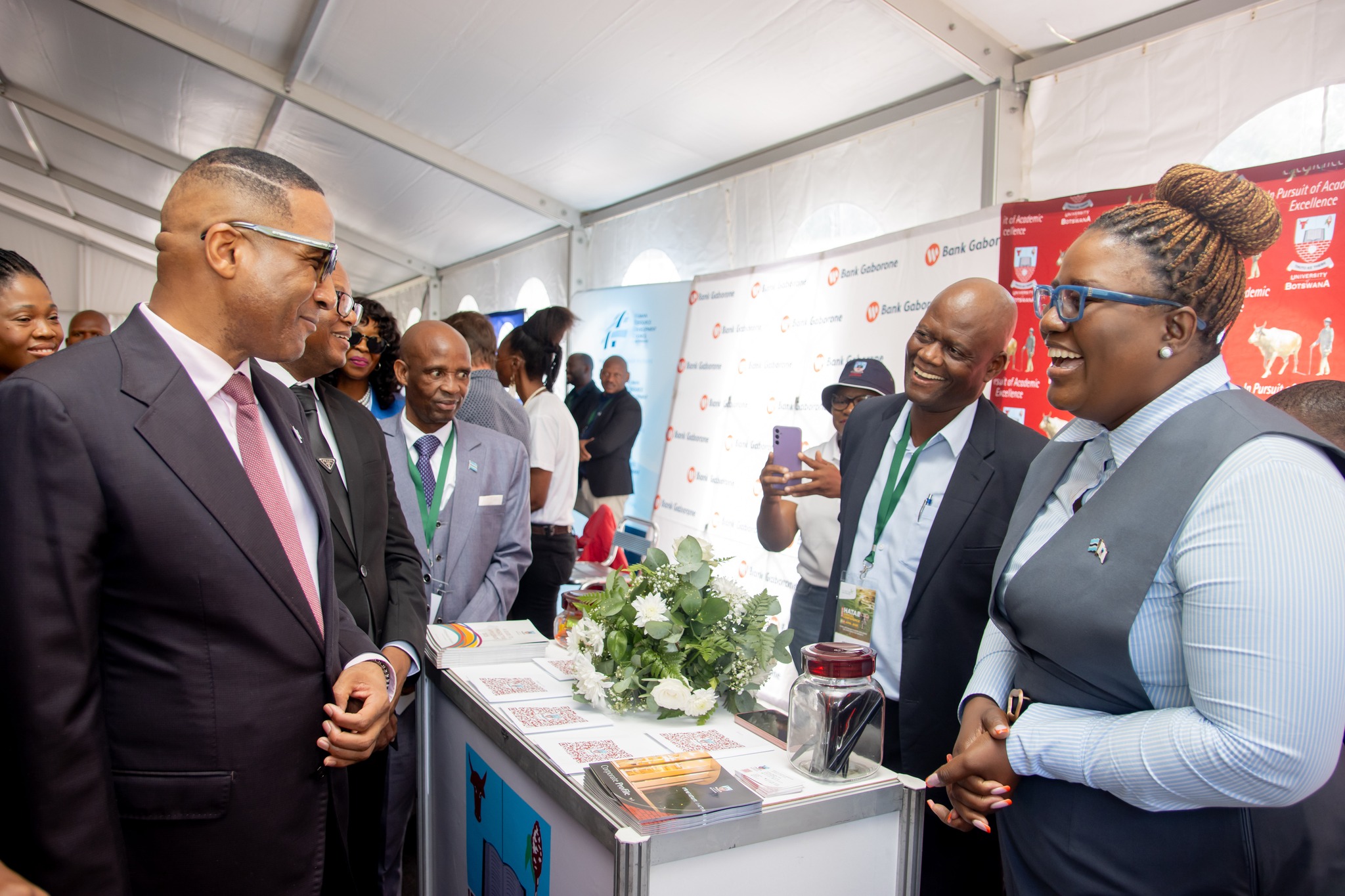 President Duma Boko Engages with UB-ORI at HATAB 2025 | Brimco President duma boko speaks with professor joseph mbaiwa at the ub ori stall during the hatab 2025 conference in maun
