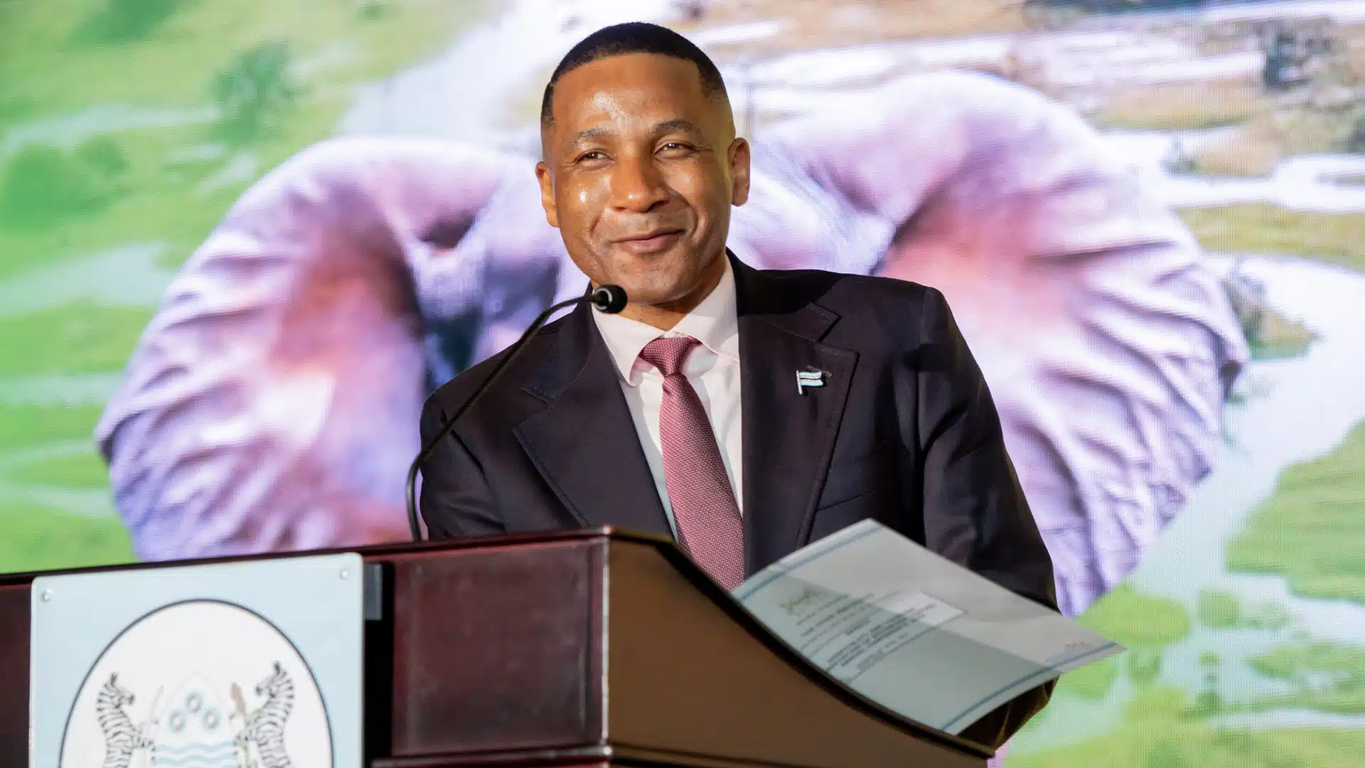 President Duma Boko Opens the 2025 HATAB Conference in Maun | Brimco President duma boko speaks at a podium during the opening of the hatab conference 2025 in maun
