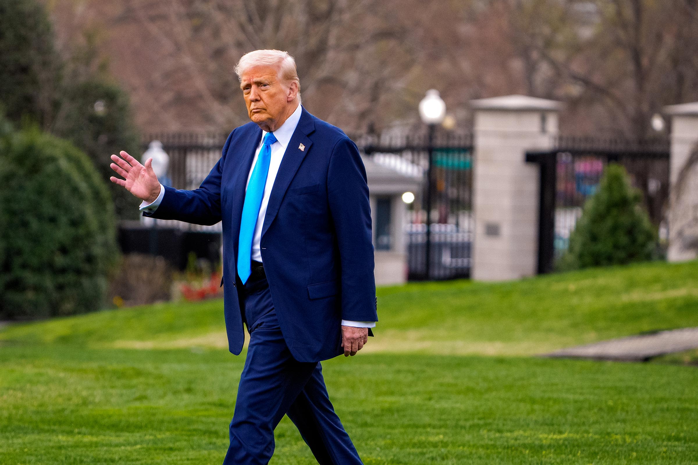 President Trump Returns to the White House Grounds | Brimco Donald trump walking on the white house lawn in a blue suit and bright blue tie