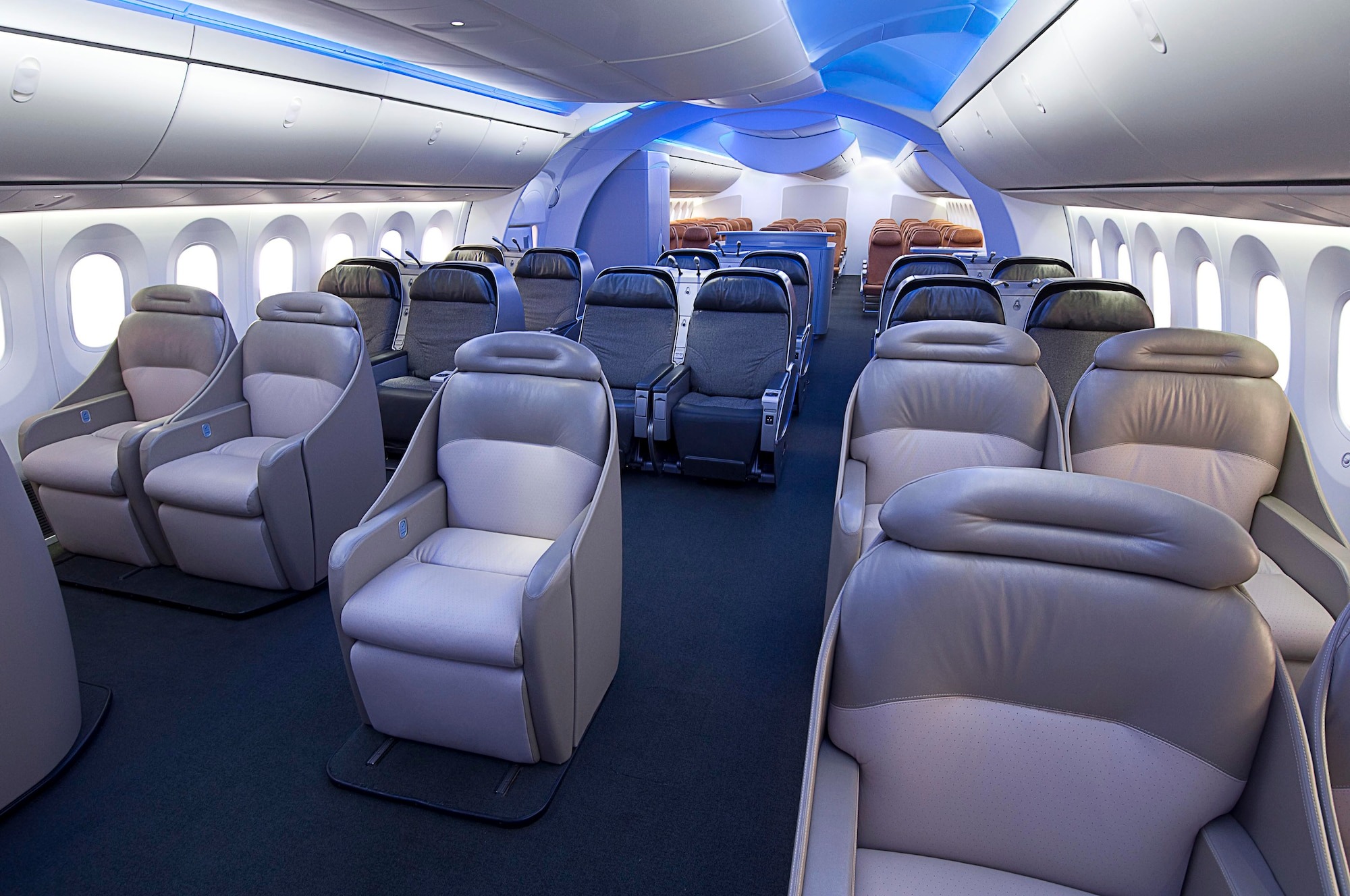 Boeing 787 Dreamliner | Brimco Interior of boeing 787 dreamliner showcasing spacious premium seats and modern cabin lighting