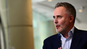 Robin vince ceo of bny mellon in a navy blue suit speaking with hands clasped during a formal discussion
