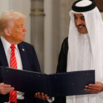 Donald Trump and Emir Sheikh Tamim bin Hamad Al Thani holding a formal document together, symbolizing a diplomatic agreement between the United States and Qatar.
