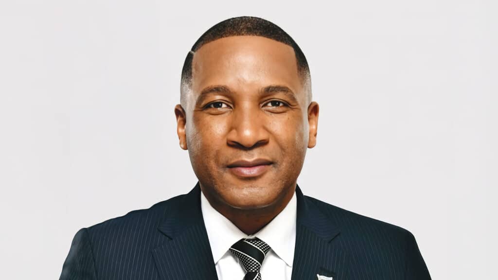 President Advocate Duma Gideon Boko – Portrait | Brimco Portrait of president advocate duma gideon boko in a dark pinstriped suit and tie facing forward against a light background