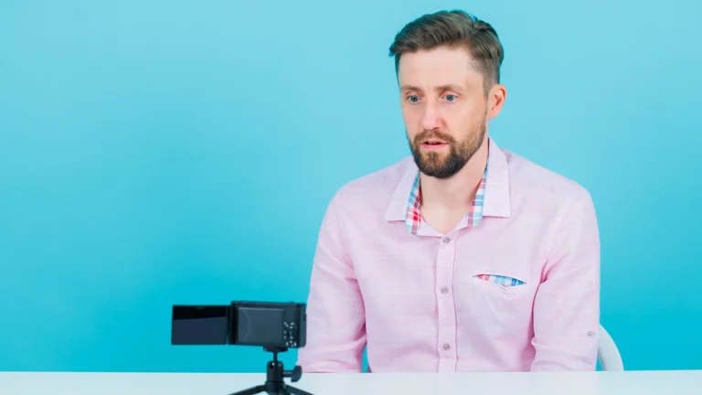 Man recording a video message with a digital camera representing digital pr and brand communication