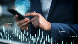 Business professional using a smartphone with financial charts and a global digital interface representing smarter investment tools