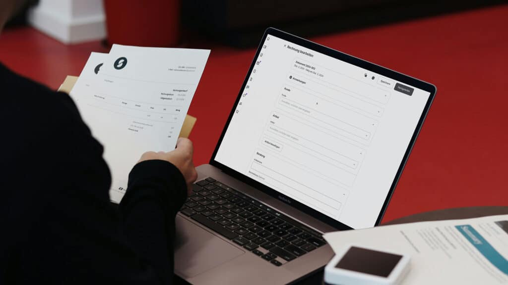 Person viewing digital invoice on laptop