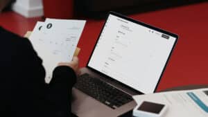 Person viewing digital invoice on laptop