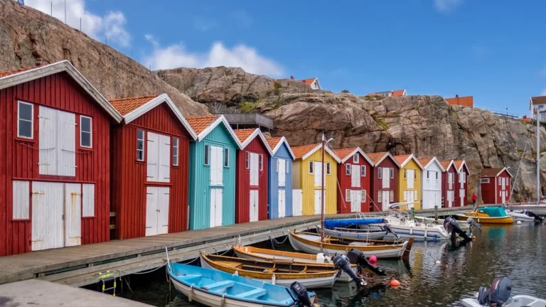 Colorful waterfront houses showcasing real estate properties with smart AI tools