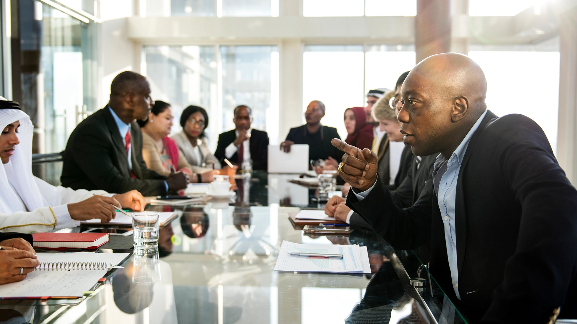 Business Resilience Strategies Meeting | Brimco Diverse group of business professionals in a meeting discussing strategies