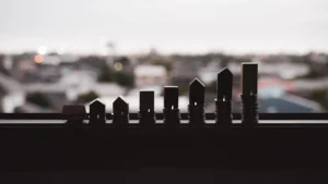 Real estate market growth represented by miniature house models on stacked coins
