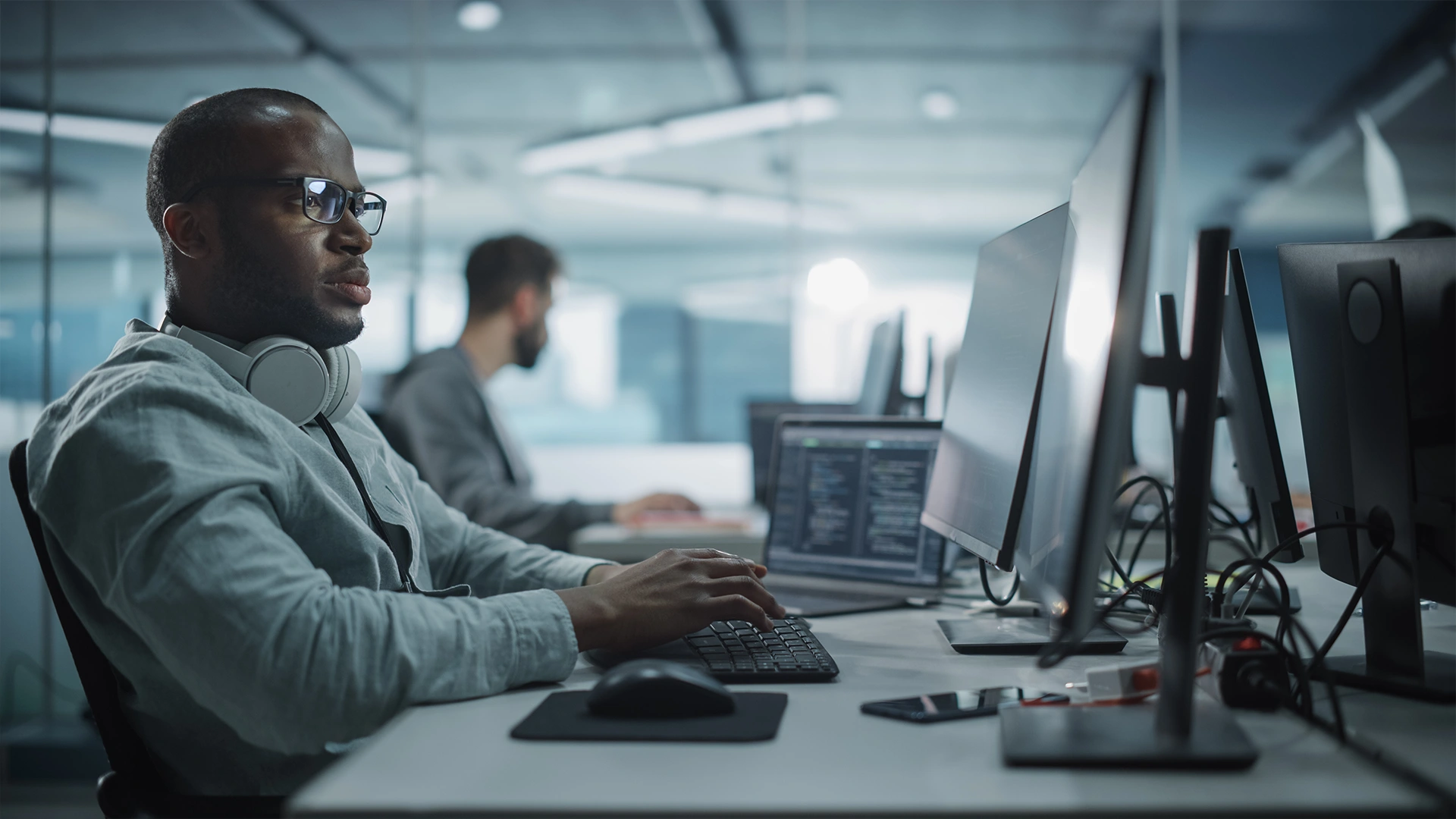 It professional working at a computer in a modern office environment