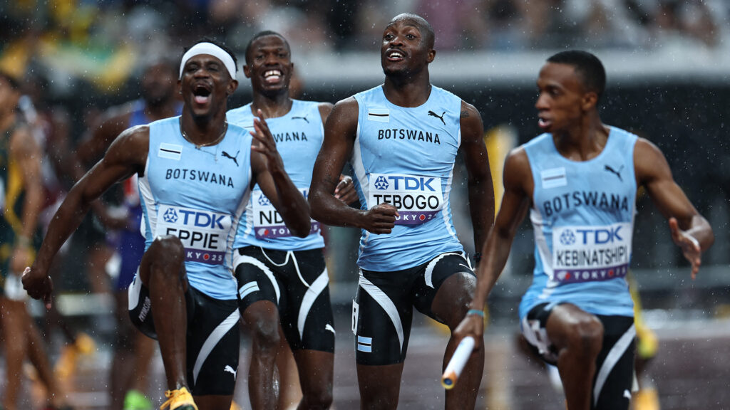Botswana 4x400m relay team members eppie ndori tebogo and kebinatshipi jubilantly celebrating their gold medal win in the rain at the 2025 world championships in tokyo