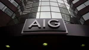 Aig headquarters building with the company logo on the entrance facade surrounded by glass skyscrapers