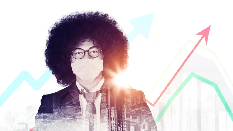 Business professional wearing a face mask with rising profit and growth chart overlay