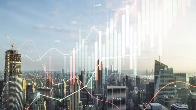 City skyline with transparent financial graphs and market data overlays representing global economic trends.