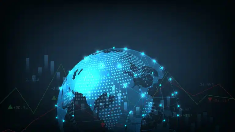 Futuristic digital globe with data points and economic graph overlays, representing global finance and interconnected markets.