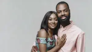 Smiling african couple posing together in a studio showing affection and togetherness