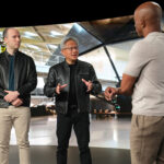 NVIDIA’s Jensen Huang speaking with OpenAI’s Sam Altman, Greg Brockman, and a host, discussing a new strategic AI partnership.