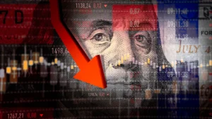 Red downward arrow over benjamin franklins portrait on the us dollar representing a stock market crash and economic decline