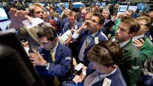 Traders on the floor of the new york stock exchange react to market volatility during the 2008 financial crisis