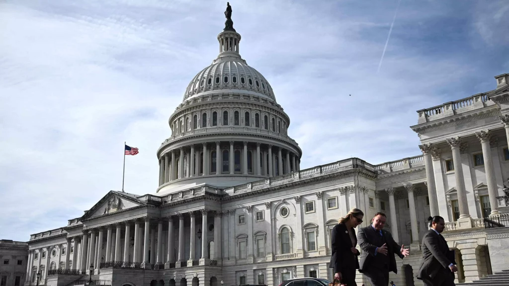 U S Capitol building with people walking outside after the government shutdown ended