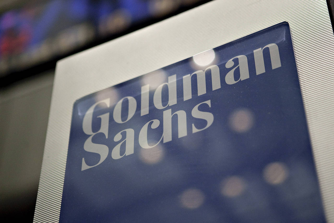 Goldman sachs logo on a metallic display panel at company headquarters
