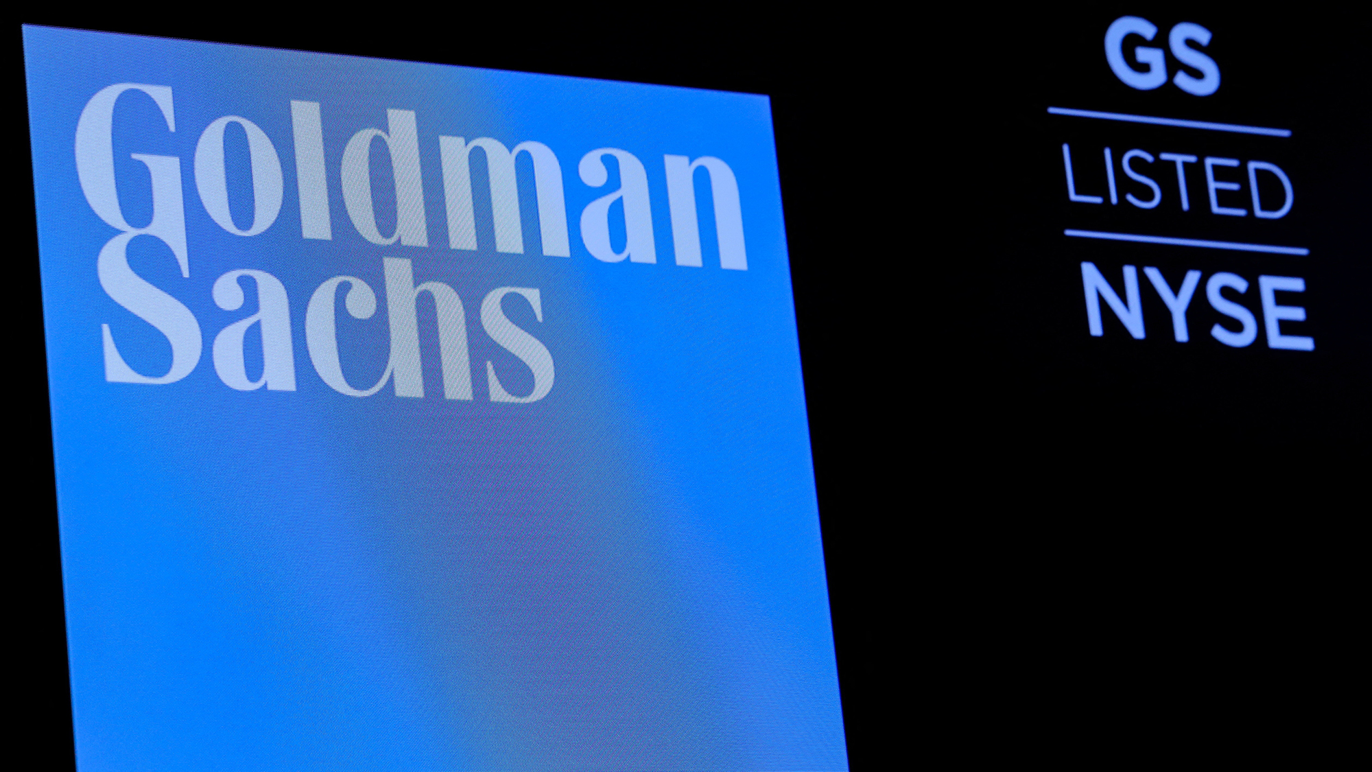 Goldman sachs logo and ticker symbol gs displayed on the new york stock exchange screen