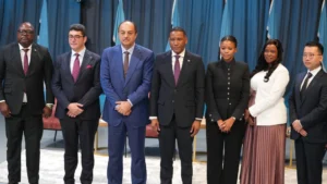 A formal group photograph of seven high level officials and business leaders at the btv headquarters in gaborone The group includes president duma boko minister bogolo kenewendo and minister phenyo butale celebrating the signing of a major energy investment agreement between botswana and a turkishasian consortium