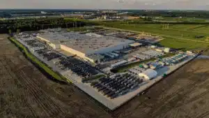 Aerial view of the colossus 2 data center under construction by xai in memphis showing large warehouse structures and surrounding infrastructure