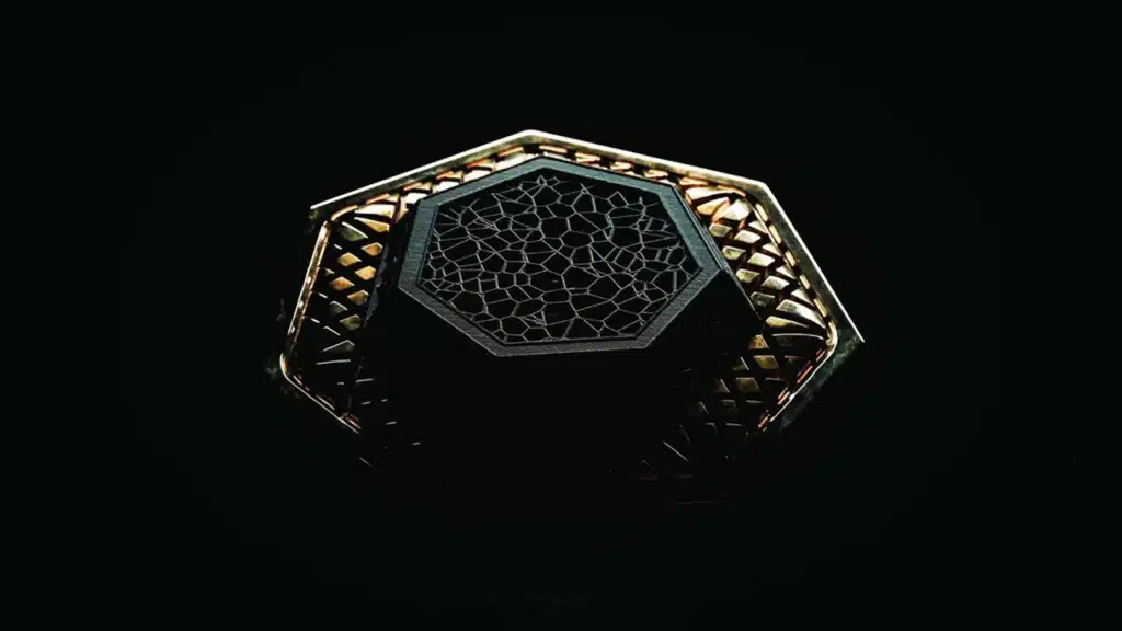 The Thermodynamic Core of Intelligence | Brimco Abstract geometric object with a hexagonal lattice like surface illuminated against a dark background symbolizing thermodynamics and physics inspired artificial intelligence