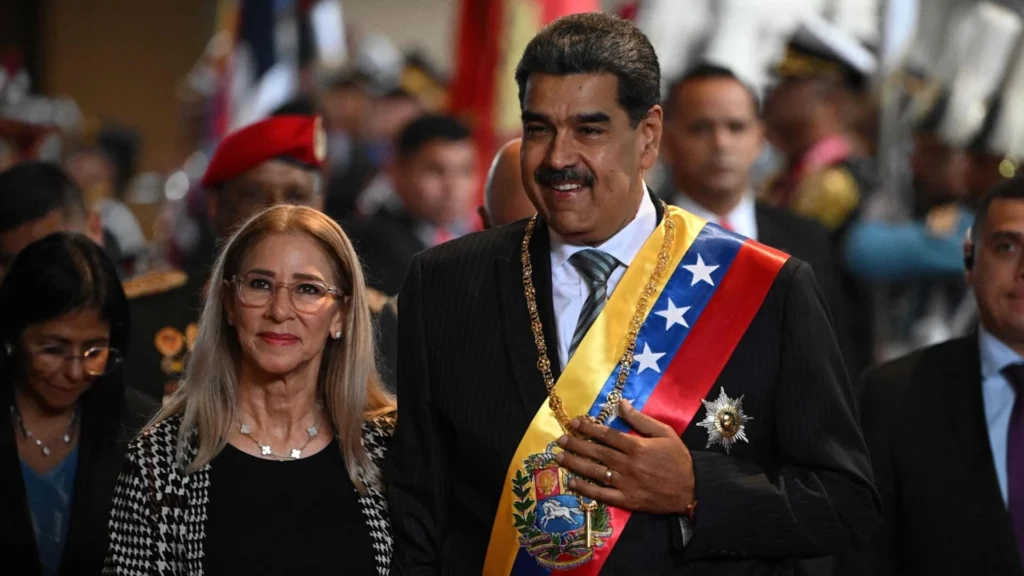 Nicolás Maduro and First Lady Cilia Flores at a State Ceremony | Brimco Venezuelas president nicolás maduro wearing the national sash walks beside his wife cilia flores during a formal state ceremony