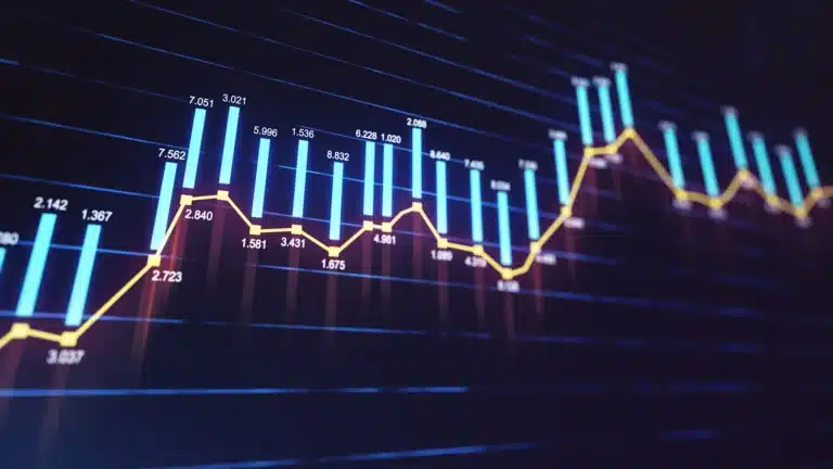 Digital financial chart with blue bar graphs and a yellow line trend showing fluctuating market data on a dark background.