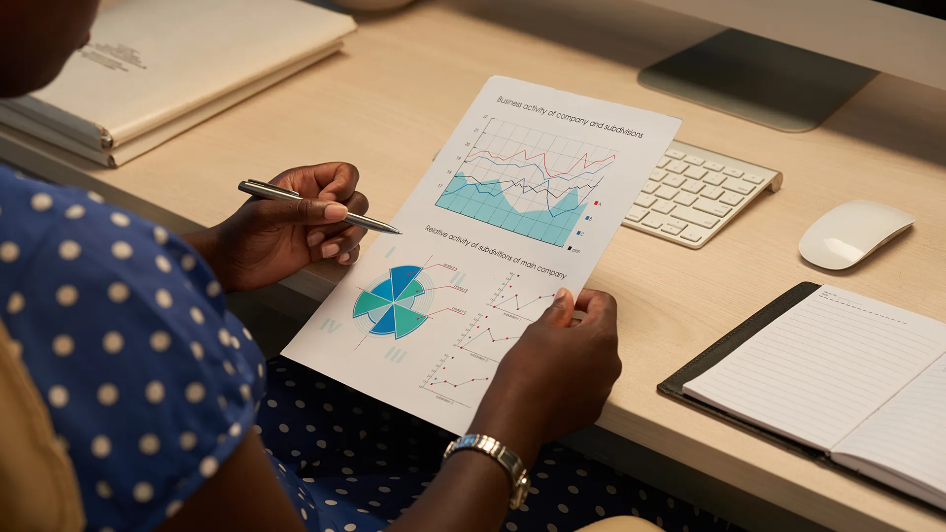 Analyzing Business Growth and Performance Metrics | Brimco Business professional reviewing company growth metrics and performance analytics charts at a desk